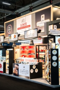 Image de stand sur mesure dans un salon, créé par le standiste expert In'Pulsion, pour Loste International