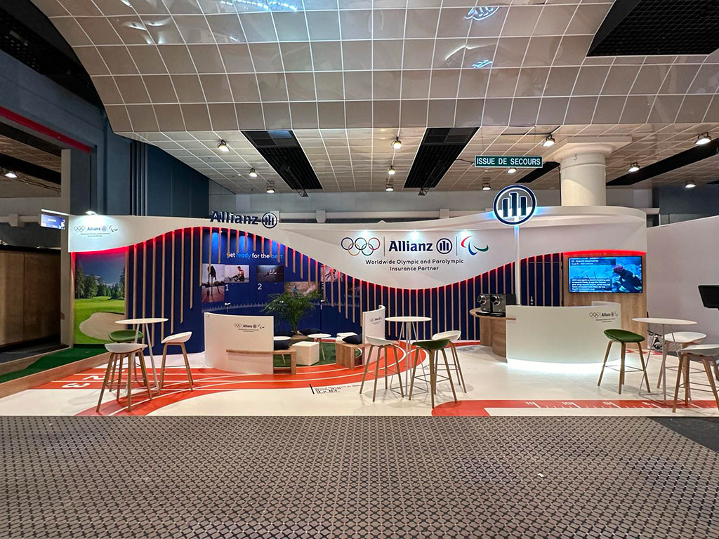 nPulsion,-stand-Allianz-AMRAE24_2 photo d'un stand réalisé pour Allianz par In'Pulsion, en 2024, sur le thème des JO Paris 2024. Un résultat optimal grâce à la réalisation efficace du cahier des charges stand salon